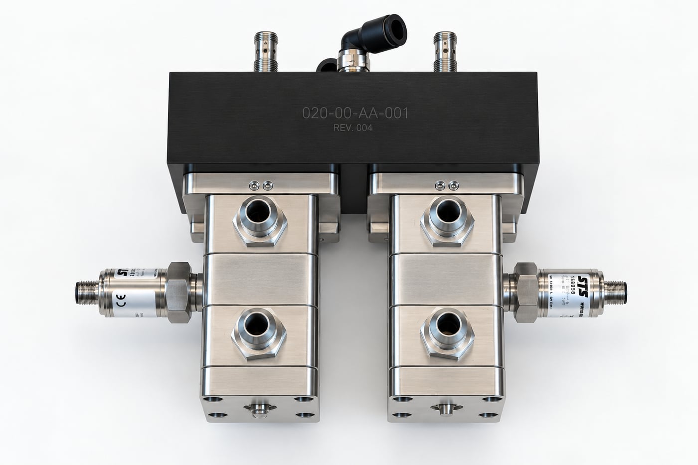 A Fluidic XV4 cross-over valve — paired stainless valve blocks with pressure transducers under a black manifold